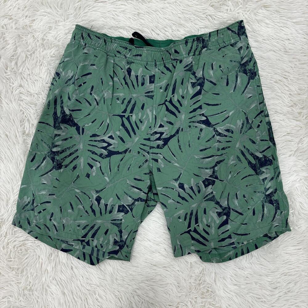 Board shorts with all over leaf design